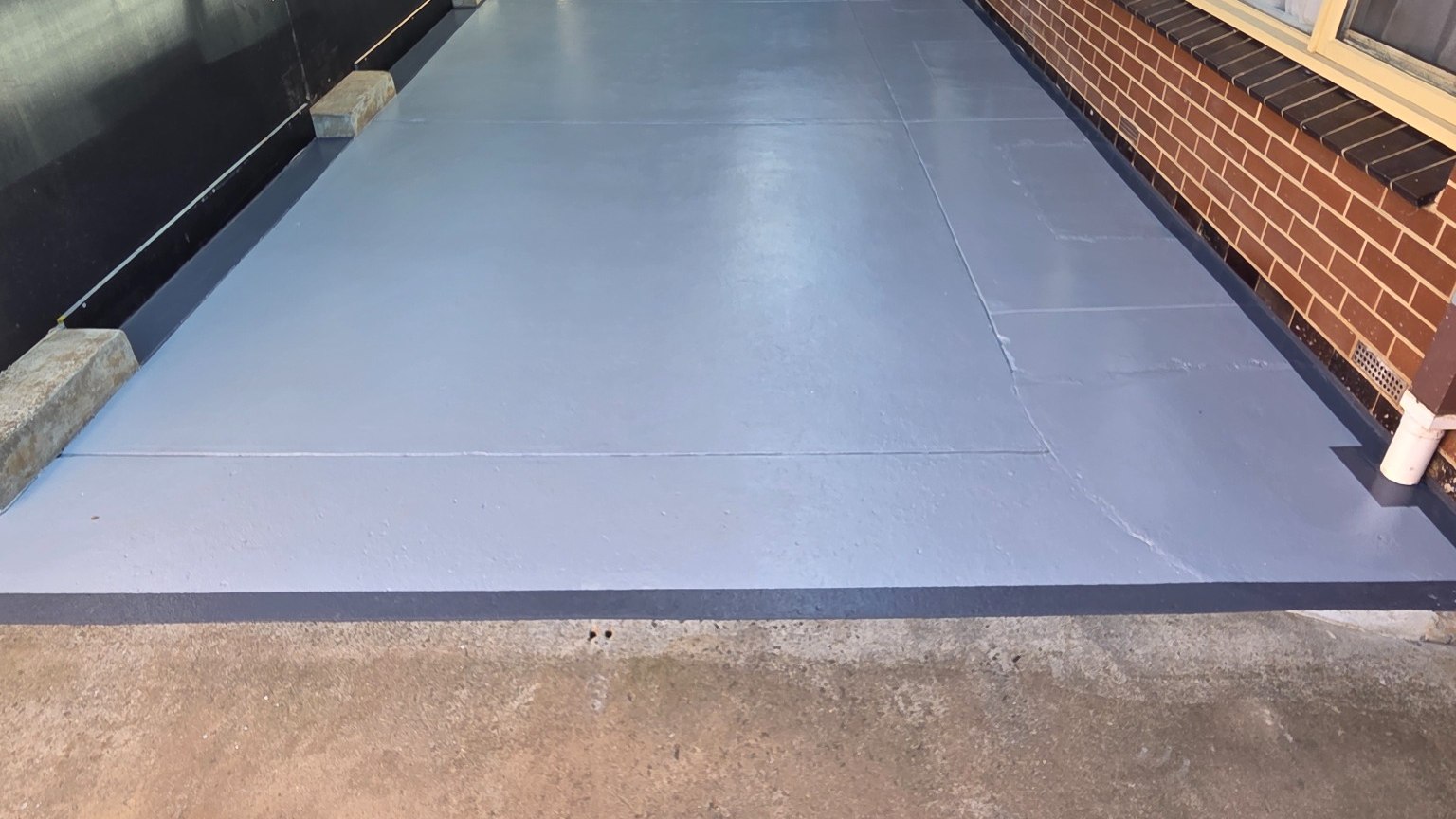Finished three-coat concrete floor coating by CBC